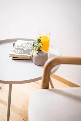 a glass of orange juice and a plant on a table at Resort po.spolu in Mokrovraty