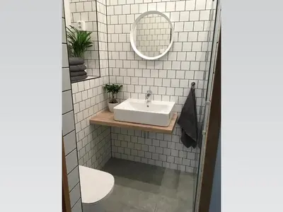 a white bathroom with a sink and a mirror at Stylish apartment 5 mins from the Charles Bridge in Prague