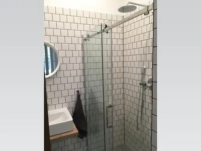 a bathroom with a shower and a sink at Stylish apartment 5 mins from the Charles Bridge in Prague