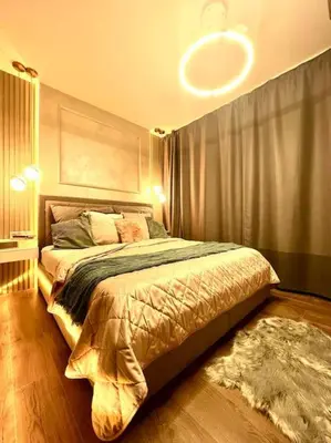 a bedroom with a large bed in a room at Luxury Pearl with Parking place in Holešovice in Prague