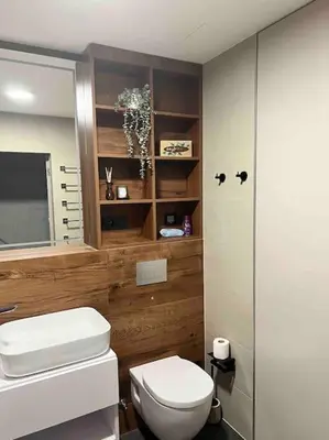 a bathroom with a white toilet and a shower at Luxury Pearl with Parking place in Holešovice in Prague
