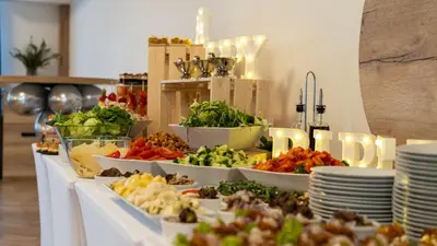 a buffet with many plates of food on a table at Penzion Racek in Tuchlovice