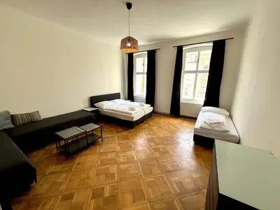 a living room with a couch and a table at Katerina's Downtown Apartments in Prague