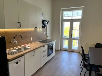 a kitchen with a sink and a counter top at Katerina's Downtown Apartments in Prague