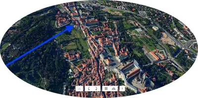 a map of a city with a blue arrow at Hradčany apartment with green energy in Prague