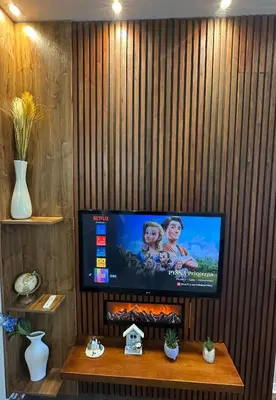 a flat screen tv on a wall in a living room at O2 Aréna -PVA expo - Tomy Apartment -Praha in Prague