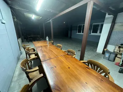 a long wooden table and chairs in a room at O2 Aréna -PVA expo - Tomy Apartment -Praha in Prague