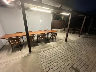 a long wooden table and chairs in a room at O2 Aréna -PVA expo - Tomy Apartment -Praha in Prague