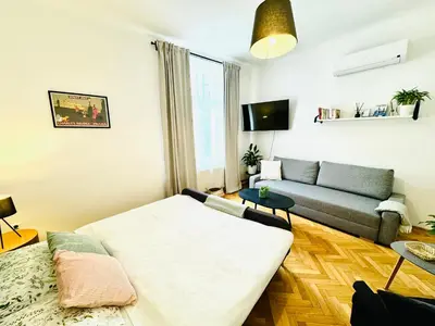 a living room with a couch and a table at Apartments by Jacob in Prague