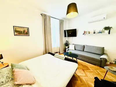 a living room with a couch and a living room with at Apartments by Jacob in Prague