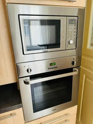a microwave sitting on top of a oven at Apartments by Jacob in Prague