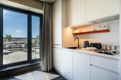 a kitchen with a view of a patio at HONEST Ricany in Ricany