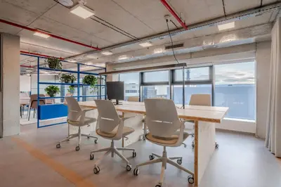 an office with a long table and chairs and windows at HONEST Ricany in Ricany