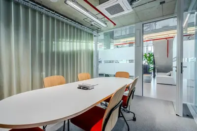 an office meeting room with a white table and chairs at HONEST Ricany in Ricany