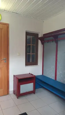 a room with a fish tank and a door at Ardilla in Lhota