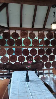 a table with a bunch of chocolate donuts on a wall at Ardilla in Lhota