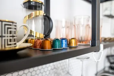 a dresser with a mirror on top of it at White Wolf House Hostel & Apartments in Prague