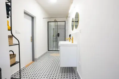 a room with bunk beds with yellow curtains at White Wolf House Hostel & Apartments in Prague