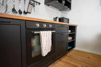 a stainless steel sink in a kitchen at White Wolf House Hostel & Apartments in Prague