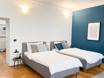 two beds sitting next to each other in a room at Best Price & Location - Historic Square Residency in Prague