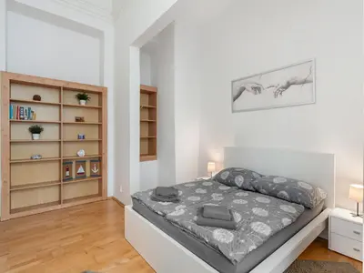 a bedroom with a bed and a book shelf at Apartment Old Town home-4 by Interhome in Prague