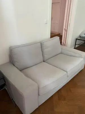 a white couch sitting in a living room at Large 3 bedroom family apartment close to the river in Prague