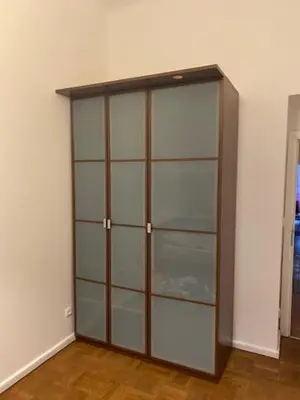 a closet with glass shelves in a room at Large 3 bedroom family apartment close to the river in Prague