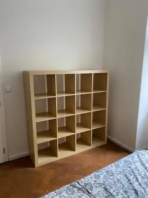a book shelf in the corner of a bedroom at Large 3 bedroom family apartment close to the river in Prague