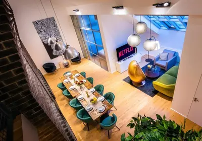 an overhead view of a table and chairs in a room at 5BR+2Bath Old Town Industrial Penthouse, A/C in Prague