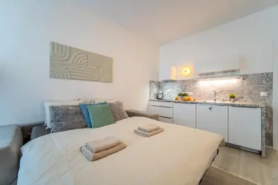 a bedroom with a bed with two towels on it at A Prague Apartment - Old Town in Prague