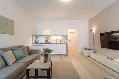 a living room with a couch and a table at A Prague Apartment - Old Town in Prague