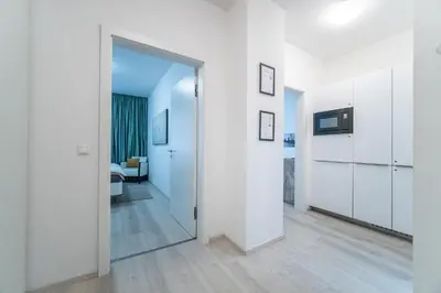 a hallway with a door leading to a bathroom at A Prague Apartment - Old Town in Prague