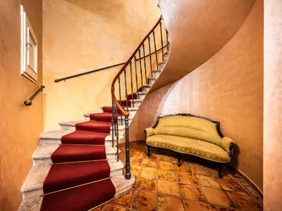 a stairway with a bench and a stair case at Nosticova Heritage in Prague