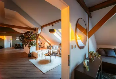 a living room with a couch and a table at 6BR Castle V!EWS A/C luxury Dolce Vita apartment in Prague