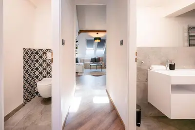 a bathroom with a toilet and a sink at 6BR Castle V!EWS A/C luxury Dolce Vita apartment in Prague