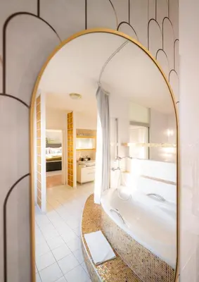 a bathroom with a tub and a large mirror at A/C LUX Rooftop APT 6BR+3.5Bath Wenceslas square in Prague