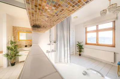a large bathroom with a tub and two sinks at A/C LUX Rooftop APT 6BR+3.5Bath Wenceslas square in Prague