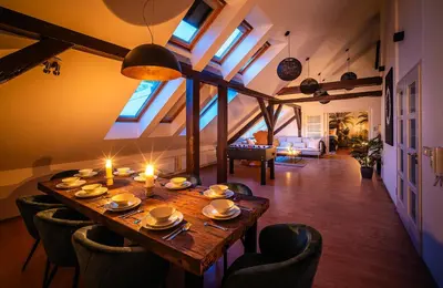 a dining room with a long table and chairs at A/C LUX Rooftop APT 6BR+3.5Bath Wenceslas square in Prague