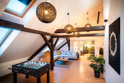 a living room with a pool table in the middle at A/C LUX Rooftop APT 6BR+3.5Bath Wenceslas square in Prague