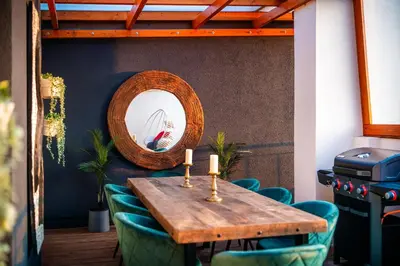 a table with two candles and a mirror at A/C LUX Rooftop APT 6BR+3.5Bath Wenceslas square in Prague