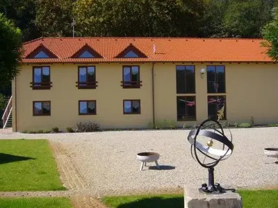 a building with a statue in front of it at Marina Vltava in Nelahozeves