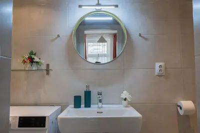 a bathroom with a shower and a sink at Stay Inn Apartments U Stundanky in Prague