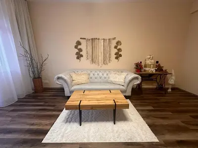 a living room with a couch and a coffee table at Eva's Apartment Prague in Prague