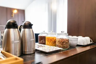a counter with jars of food on a table at A1 Royal Plaza in Prague
