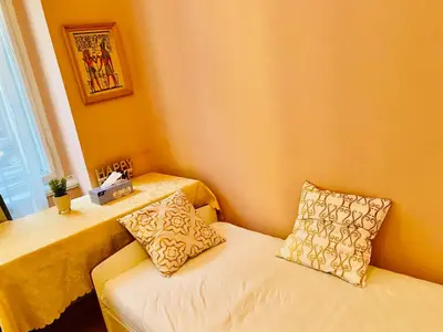 a room with a table and a couch with pillows at aparthotel in Prague Centre in Prague