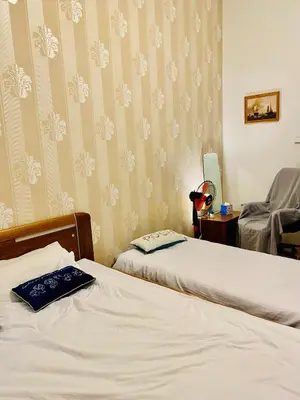 a hotel room with two beds and a mirror at aparthotel in Prague Centre in Prague