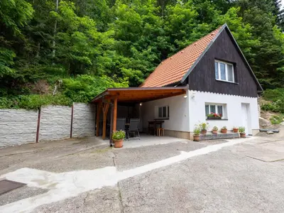 a small white house with a brown roof at Holiday Home Zimořský domek by Interhome in Dolní Zimoř