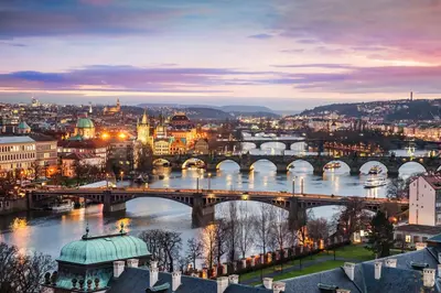 a view of a city with a bridge and a river at Adam's Apartment - Best Location in Prague