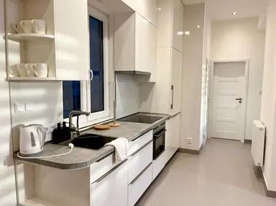 a living room with a couch and a table at Modern flat in Central Prague in Prague