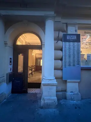 a entrance to a building with a sign on it at Nika Apartments Prague 2 in Prague